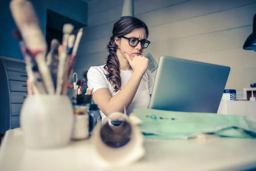 Women frowning at a laptop