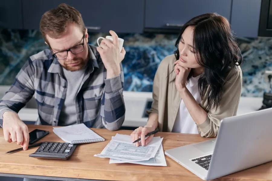 Couple looking at bills