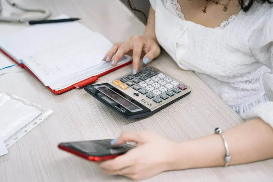 woman using calculator