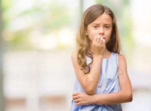 young girl looking worried