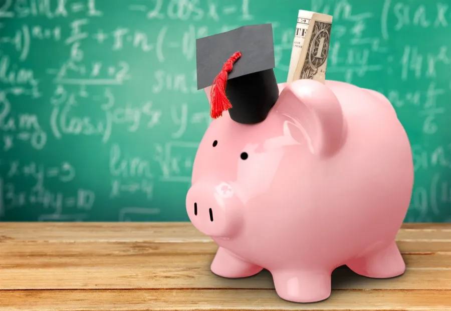 Piggy bank with graduate hat on