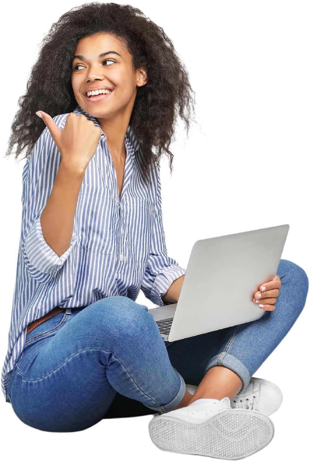 Brunette woman sat on the floor with a laptop, pointing left