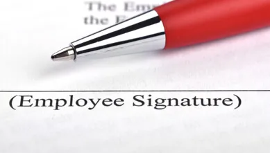 Employee signature with red pen effects of insolvency
