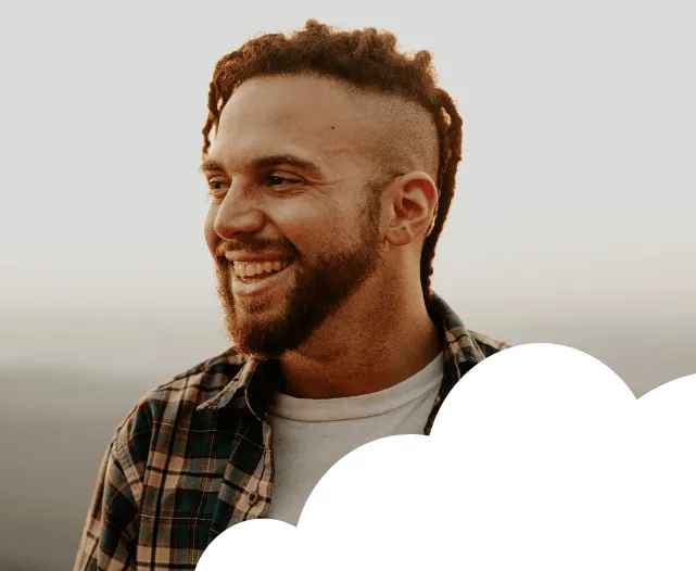 Man smiling with cloud overlap in the bottom right side