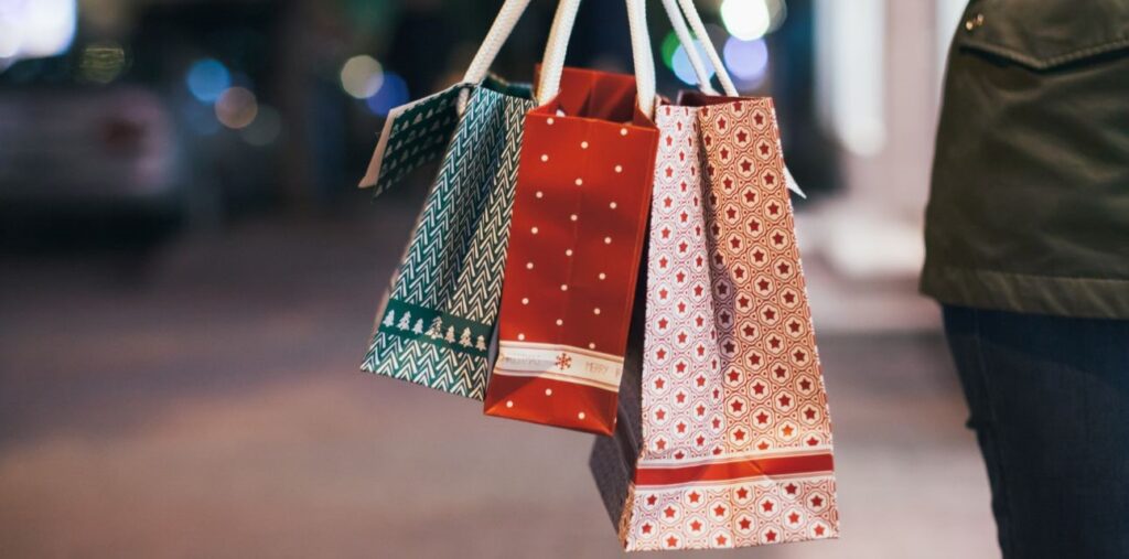 woman carrying Christmas bags