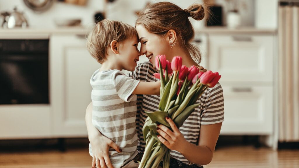 mother and son holding tulip bouquet