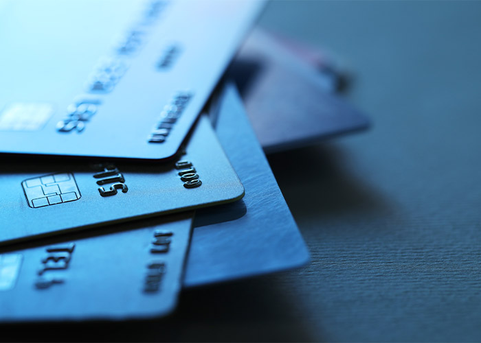 many debit cards stacked on top of each other