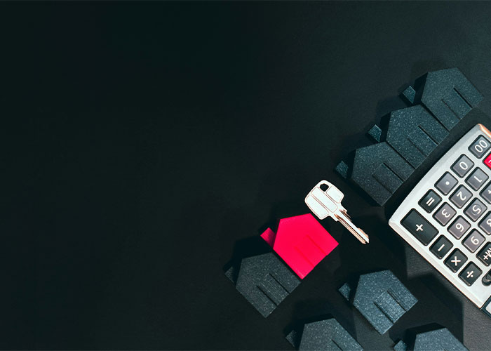 A calculator with a house key and home icons