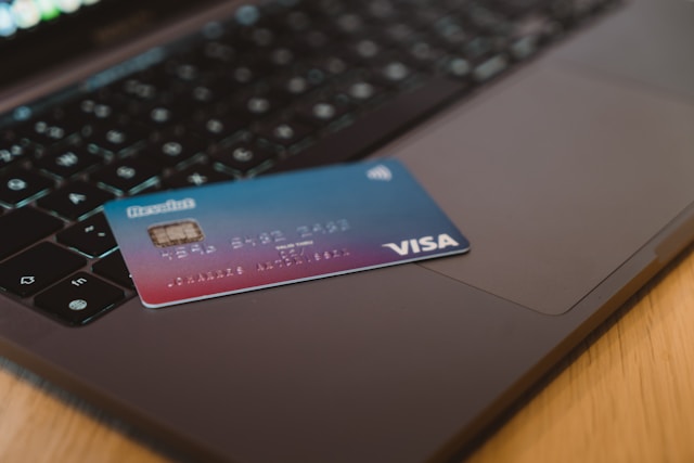A Debit Card On A Laptop
