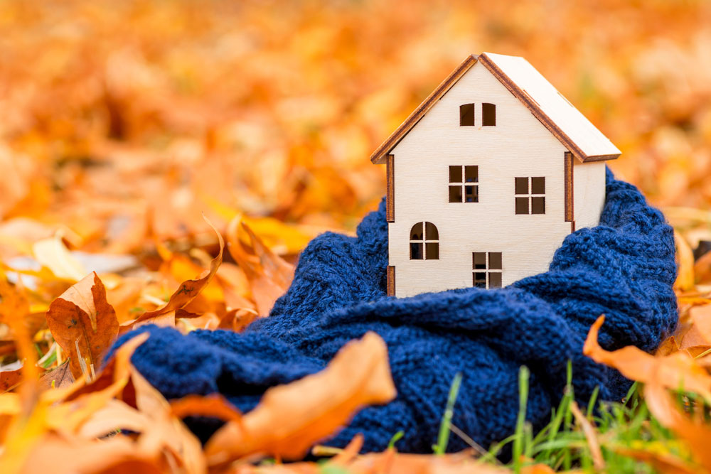 a wooden house with a blanket over it