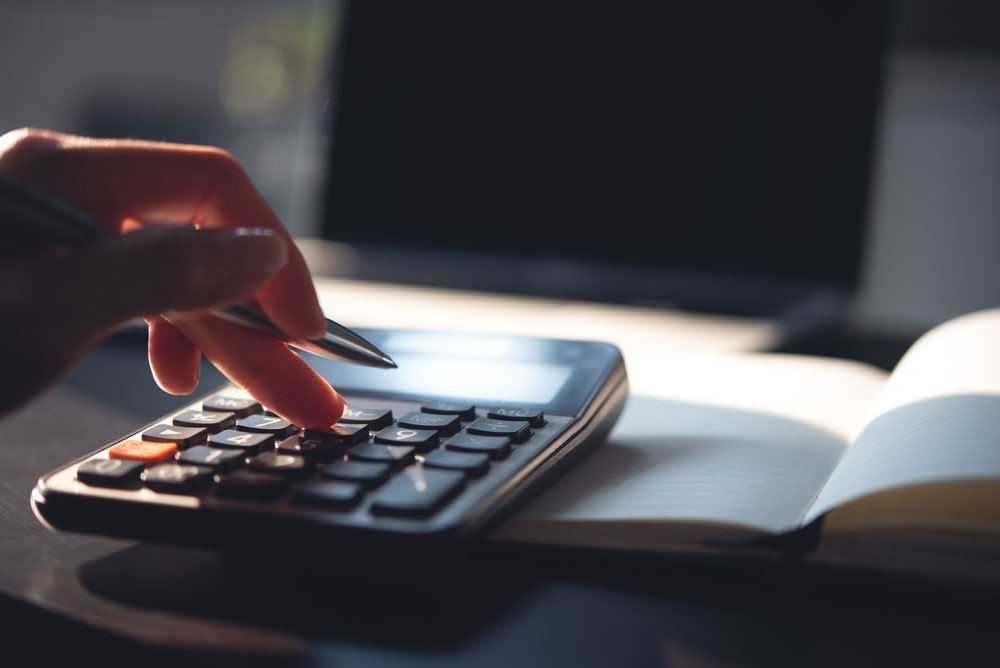 a person working something out with a calculator