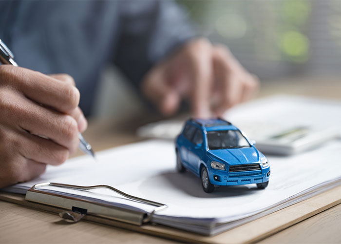 a model car on finance papers