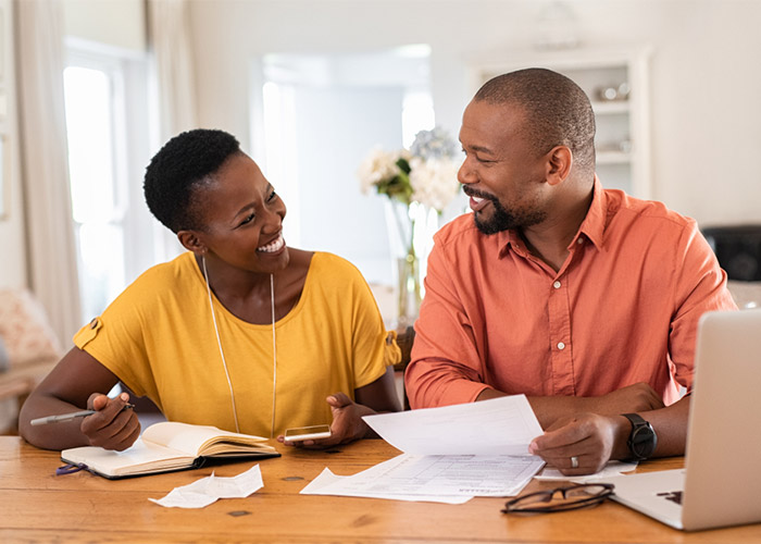 a couple discussing and planning their finances together