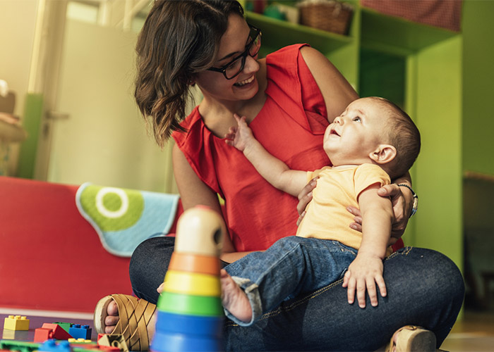 a child care provider looking after a child