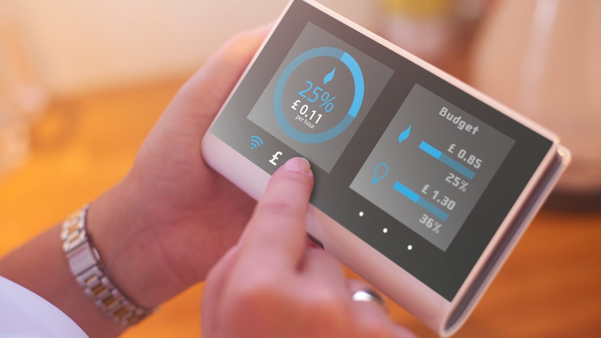image of a hand holding a smart meter for energy bill