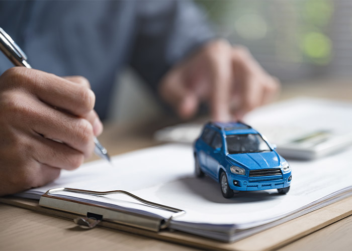 a model car on car finance paperwork