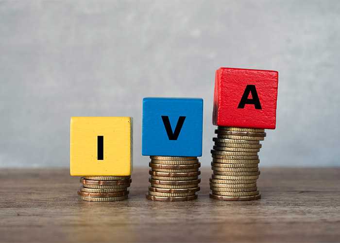 blocks on top of coin stacks that spell out IVA