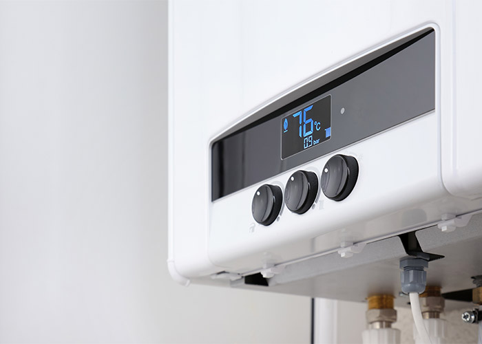 Close-up regulators on a modern digital gas boiler.