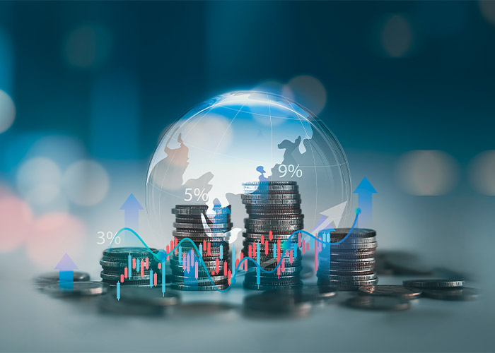 A globe with charts and coin stacks in front of it to symbolise global household debt